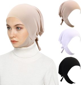 Annotated photo of a hijab over an under-cap showing pin points under the chin, at the crown and at each shoulder