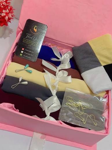 Layl hijab gift set with several folded hijabs in matching colours in a gift box