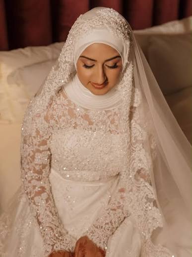 Two-layer bridal hijab with a sheer ivory chiffon layer draped over a fitted nude base